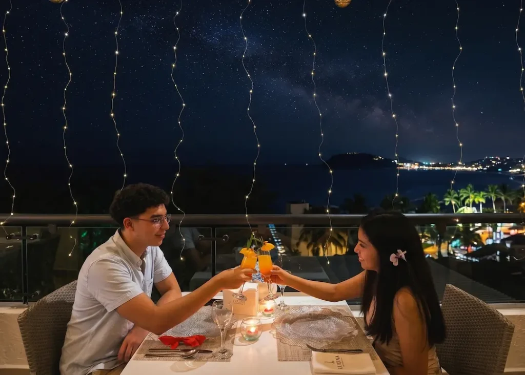 Personas disfrutando una comida en un restaurante con terraza en Manta y vista al aire libre